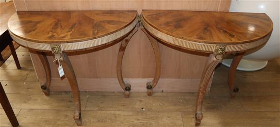 A pair of yew, pine and giltwood demi lune side tables W.92cm